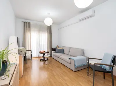 a living room with a couch and a table at Apartoyou - Plaza San Juan in El Puerto de Santa María
