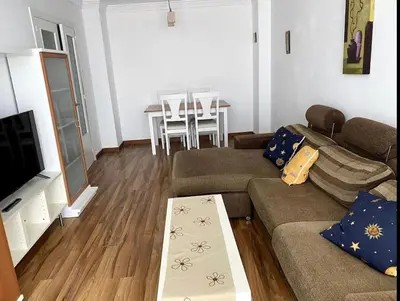 a living room with a couch and a table at Excelente piso en San Fernando in San Fernando