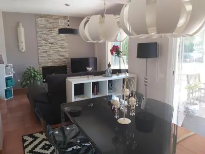 a living room with a table and a couch at VILLA DEL MAR in Novo Sancti Petri
