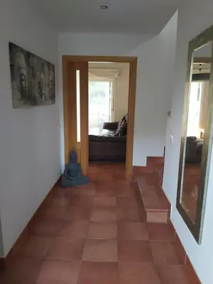 a hallway with a staircase and a couch in a room at VILLA DEL MAR in Novo Sancti Petri