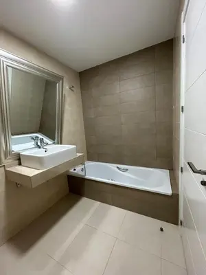a bathroom with a sink and a bath tub at BAJO GUÍA DELUXE in Sanlúcar de Barrameda