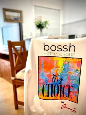 a shirt that saysboss hotel group and my choice on a table at MyChoice Dadim in Rota