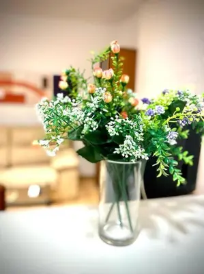 a vase filled with flowers sitting on a table at MyChoice Dadim in Rota