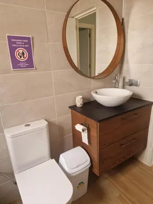 a bathroom with a sink and a toilet and a mirror at VILLA ESTRELLA in Inmaculada