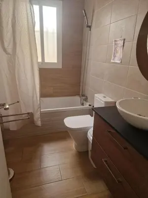 a bathroom with a toilet and a tub and a sink at VILLA ESTRELLA in Inmaculada