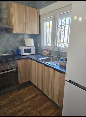 a kitchen with a sink and a microwave at VILLA ESTRELLA in Inmaculada