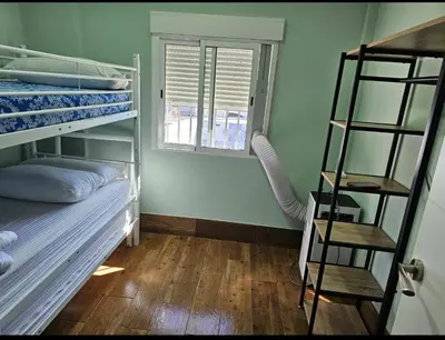 a room with two bunk beds and a ladder at VILLA ESTRELLA in Inmaculada