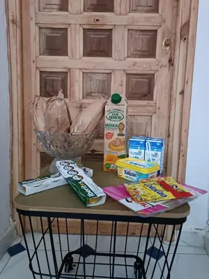 a table with food and other items on it at Apartamentos Arquillo de Rota in Sanlúcar de Barrameda