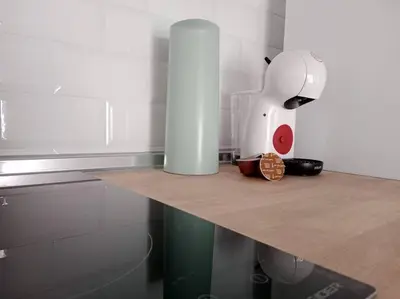a kitchen counter with a mixer on top of it at Apartamento Peonía in Jerez de la Frontera