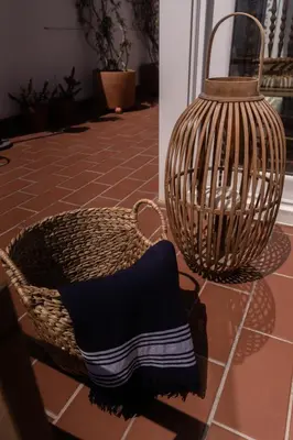 two baskets sitting on a tiled floor next to a door at Rosario17 by 7Escalones in Rota