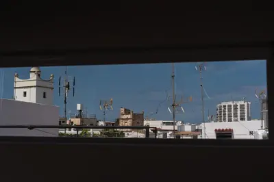 a view of a city from a window at Rosario17 by 7Escalones in Rota