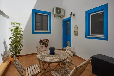 a dining room with a table and chairs at Apartamento Obispo centro Jerez de la Frontera in Jerez de la Frontera