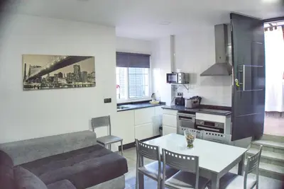 a living room with a couch and a table at Apartamento Vistas de Doñana in Sanlúcar de Barrameda