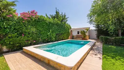 a swimming pool in a yard with a fence at Villa El Cortijo Andaluz Conil de la Frontera by Ruralidays in Conil de la Frontera