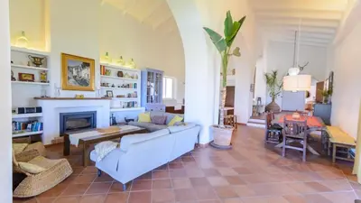 a living room with a blue couch and a fireplace at Finca Las Encinillas Arcos de la Frontera by Ruralidays in Arcos de la Frontera