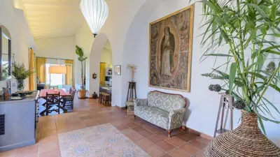 a living room with a couch and a chair at Finca Las Encinillas Arcos de la Frontera by Ruralidays in Arcos de la Frontera