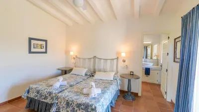 a bedroom with a bed with towels on it at Finca Las Encinillas Arcos de la Frontera by Ruralidays in Arcos de la Frontera
