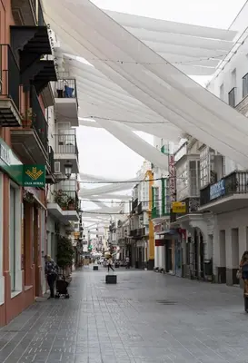 an empty street in a city with buildings at Apartoyou - Luna Centro in El Puerto de Santa María