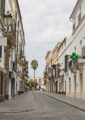 an empty street in a city with buildings at Apartoyou - Luna Centro in El Puerto de Santa María