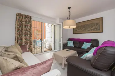 a living room with a couch and a table at Los Jandalos in El Puerto de Santa María