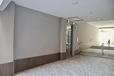 a hallway of a building with stairs and a window at Apartamento San Leonardo Playa (Free Parking) in Cádiz