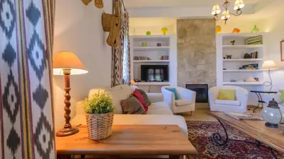 a living room with a couch and a table at Cortijo Escondido Arcos de la Frontera by Ruralidays in Arcos de la Frontera