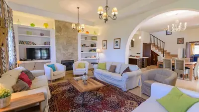 a living room with white couches and a table at Cortijo Escondido Arcos de la Frontera by Ruralidays in Arcos de la Frontera