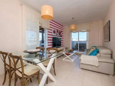 a living room with an american flag painted on the wall at Apartment Punta Candor - Seaview by Interhome in Rota