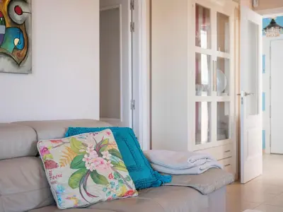 a couch with two pillows on it in a living room at Apartment Punta Candor - Seaview by Interhome in Rota