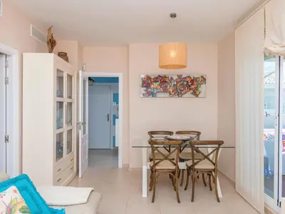 a dining room with a table and chairs at Apartment Punta Candor - Seaview by Interhome in Rota