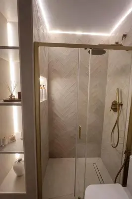 a shower with a glass door in a bathroom at Villa Tropical a 2 minutos del Faro de Chipiona in Chipiona