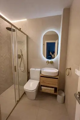 a bathroom with a toilet and a sink and a shower at Villa Tropical a 2 minutos del Faro de Chipiona in Chipiona