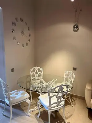 a dining room with a glass table and chairs at Villanueva Golf- Cozy 2 Bedrooms -Puerto Real, Cádiz in Puerto Real