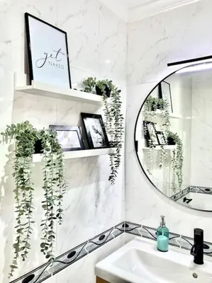 a bathroom with a sink and a mirror at Papallona Cádiz Apartment Grupo AC Gestion in Cádiz