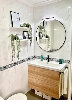 a bathroom with a sink and a mirror at Papallona Cádiz Apartment Grupo AC Gestion in Cádiz