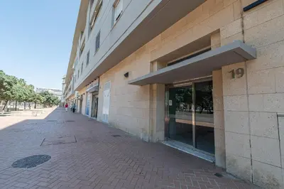 an empty sidewalk in front of a building at Apartamento Cortadura Playa in Cádiz