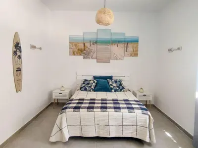 a bedroom with a bed and two night stands at Estudio Mar Azul Grupo AC Gestion in Cádiz