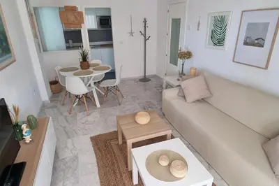 a living room with a couch and a table at Apartamento Any en Rota in Rota