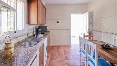 a kitchen with a sink and a counter top at Villa Lola 14 Chiclana de la Frontera by Ruralidays in Chiclana de la Frontera