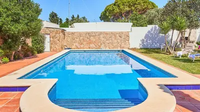 a swimming pool in the backyard of a house at Villa Lola 14 Chiclana de la Frontera by Ruralidays in Chiclana de la Frontera