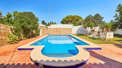 a swimming pool in the backyard of a house at Villa Lola 14 Chiclana de la Frontera by Ruralidays in Chiclana de la Frontera