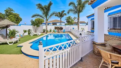 a villa with a swimming pool and a patio at Villa Bananera Conil de la Frontera by Ruralidays in Conil de la Frontera