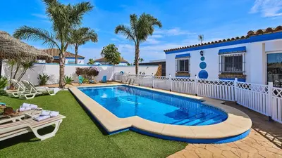 a swimming pool in the yard of a house at Villa Bananera Conil de la Frontera by Ruralidays in Conil de la Frontera