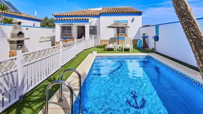 a swimming pool in the backyard of a house at Villa Yuca Conil de la Frontera by Ruralidays in Conil de la Frontera