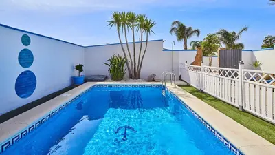 a swimming pool in the backyard of a house at Villa Yuca Conil de la Frontera by Ruralidays in Conil de la Frontera