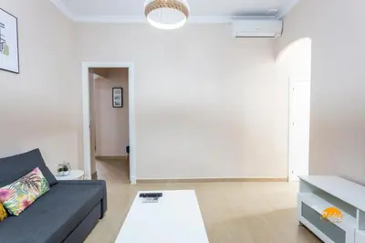 a living room with a couch and a table at Corralon de los Carros by Cadiz Time in Cádiz