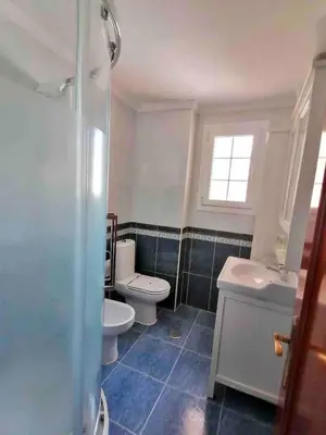 a bathroom with two toilets and a sink at Mar Vendaval Grupo AC Gestion in Cádiz
