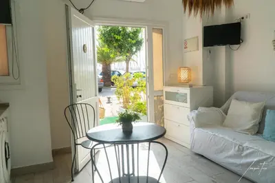 a living room with a table and a couch at Puerto Sherry Boat in El Puerto de Santa María