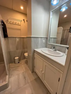 a bathroom with a sink and a mirror at Mirador de Sanlucar 6 in Sanlúcar de Barrameda