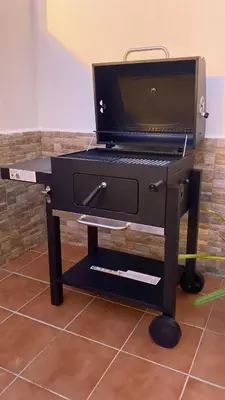 a black piano sitting on top of a table at Casa Ohana in Conil de la Frontera